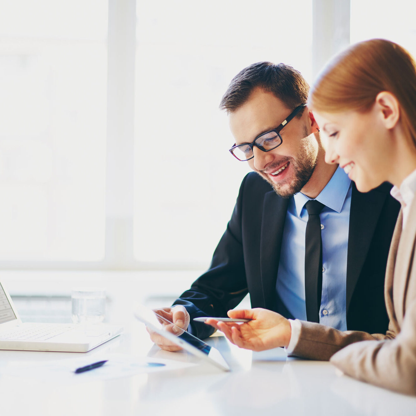 businessmen-talking_AdobeStock_67274282web-circle